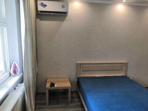 Кровать или кровати в номере Apartment On Naugorskoye Shosse