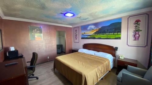 Letto o letti in una camera di Villa Park Motel