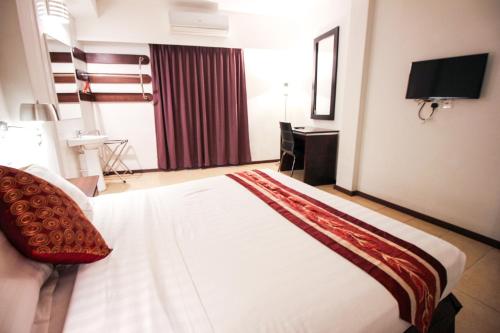 Ipoh Concept Servicesにあるベッド