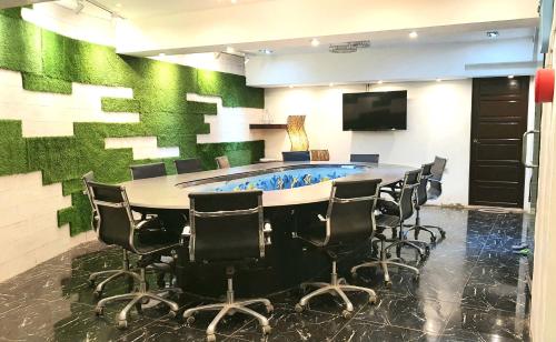 a conference room with a large table and chairs at Boracay Grace Hotel in Boracay