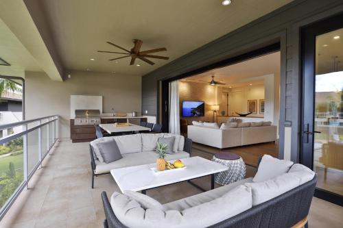 a living room with couches and a dining room at Honua kai - Luana Garden Villa 3C in Kaanapali
