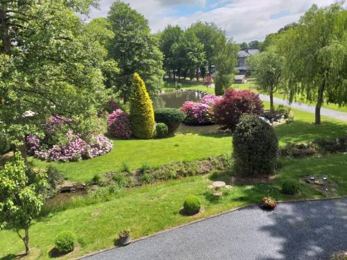 an aerial view of a garden with bushes and flowers at Château Les Tourelles in Bertrix