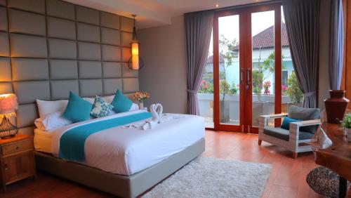 Кровать или кровати в номере Elmina Villa Bali