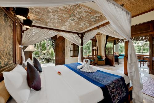 Postel nebo postele na pokoji v ubytování Alam Shanti Ubud