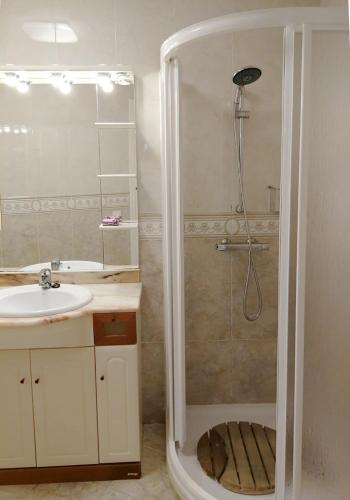 a bathroom with a shower and a sink at A3A Marina View in Torredembarra
