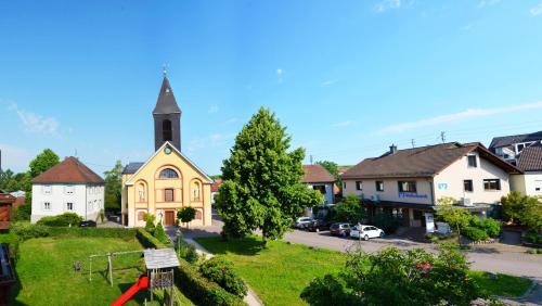 a small town with a church and a street at Gasthof zur Traube in Bühl