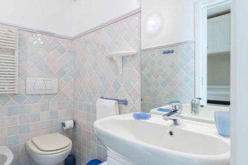 a bathroom with a sink and a toilet at Villa Rocky - Luxury 3BR Apt in Liberty Villa.Pool,Garden,WiFi in Roquebrune-Cap-Martin