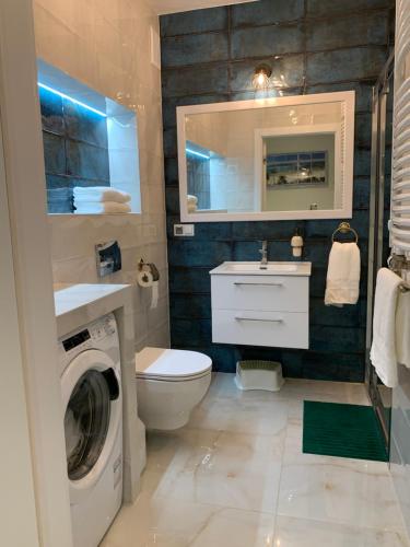 Kúpeľňa v ubytovaní Apartament Jantarowe Zacisze Blue