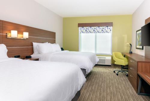 a hotel room with two beds and a window at Holiday Inn Express Calhoun South by IHG in Calhoun