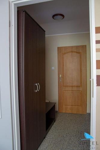 a door to a room with a wooden door at Na Skarpie in Olsztyn