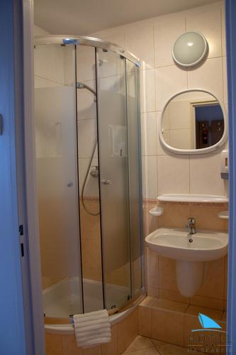 a bathroom with a shower and a sink at Na Skarpie in Olsztyn