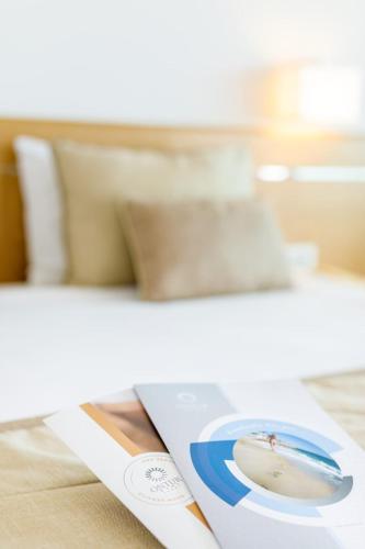 a computer mouse sitting on top of a paper at Grand Hotel Ontur Cesme in Cesme