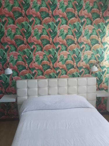 En eller flere senge i et værelse på Alexia Beach