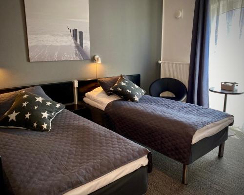 Postel nebo postele na pokoji v ubytování Taastrup Park Hotel