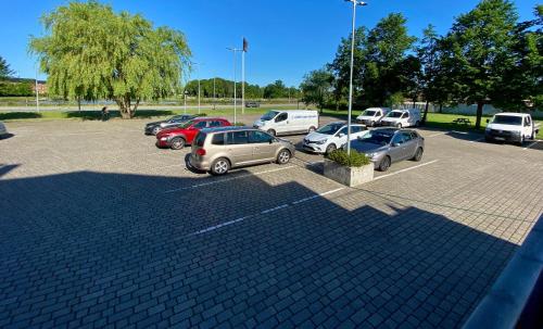 a group of cars parked in a parking lot at Taastrup Park Hotel in Tåstrup
