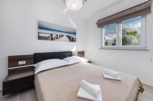 Posteľ alebo postele v izbe v ubytovaní Apartments Blanka House