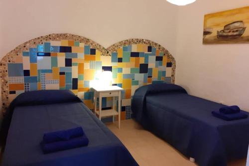 Ένα ή περισσότερα κρεβάτια σε δωμάτιο στο VILLA LA TEGALA