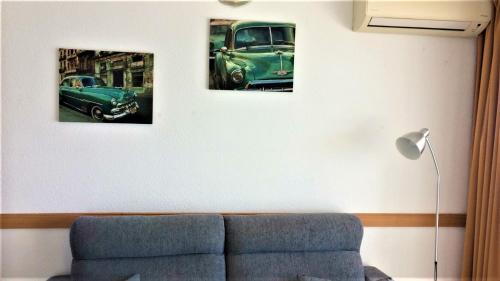 two pictures of a green car on a wall at Levante Trip - Family Apartments in Benidorm