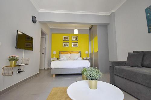 a living room with a bed and a couch at Check Point - Acropolis in Athens