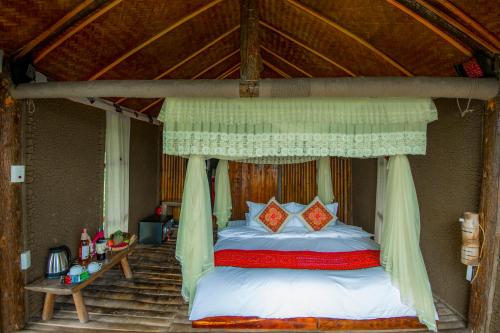 a bedroom with a canopy bed in a tent at Eco Palms House - Sapa Retreat in Sapa