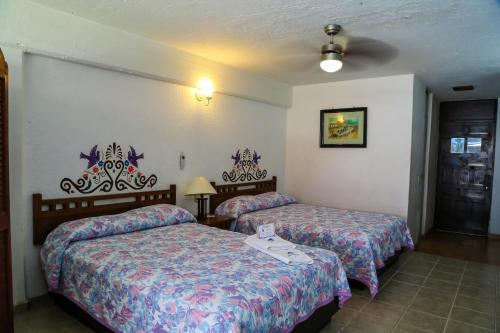Cama o camas de una habitación en Vallartasol Hotel