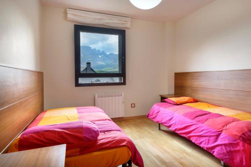 Postel nebo postele na pokoji v ubytování Peña Sabocos, apartamento turístico Panticosa