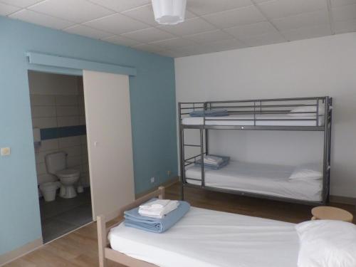Ένα ή περισσότερα κρεβάτια σε δωμάτιο στο Appartements des Joncas