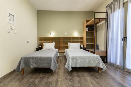 Postel nebo postele na pokoji v ubytování Pegasus Rooms
