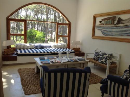 a living room with a couch and a table at Kalá Hotel Boutique in Punta del Este