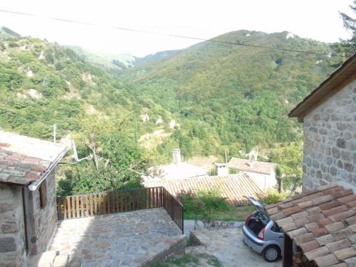 a small car parked in front of a house at LE MYRO in Péreyres