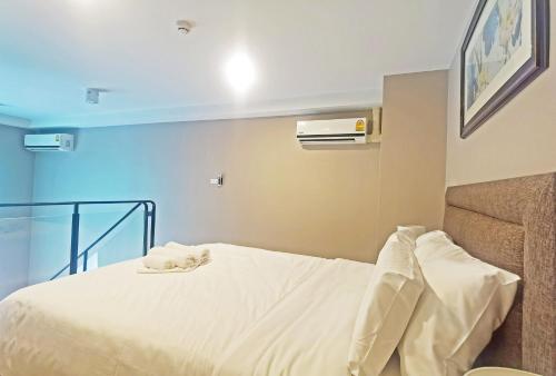 Katil atau katil-katil dalam bilik di Blossom Sathorn Hospitality （曼谷高端酒店公寓）