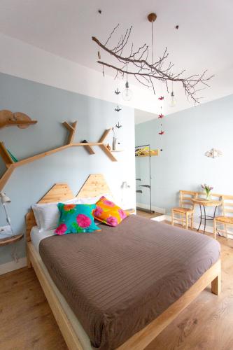 a bedroom with a large bed with colorful pillows at Napoli Bonita b&b in Naples