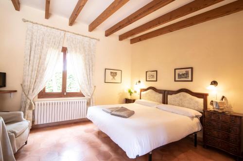 Ένα ή περισσότερα κρεβάτια σε δωμάτιο στο Aumallia Hotel & Spa