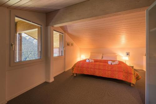 Chalet Primula Penthouseにあるベッド