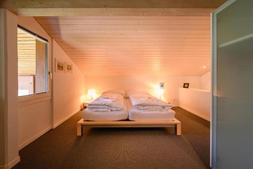 Chalet Primula Penthouseにあるベッド