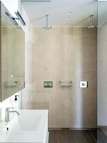 a bathroom with a sink and a shower at B&B Welness Sport and Pleasure in Laarne