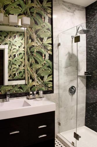 a bathroom with a sink and a shower at The Litchfield Inn in Litchfield