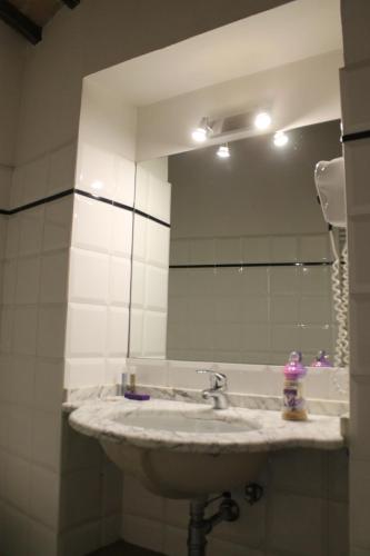 a bathroom with a sink and a mirror at Ospitalità Collicola in Spoleto