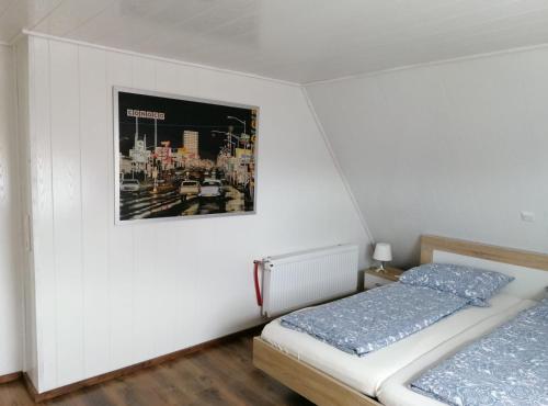 A bed or beds in a room at Ferienhaus Krabbenloch Friedrichskoog