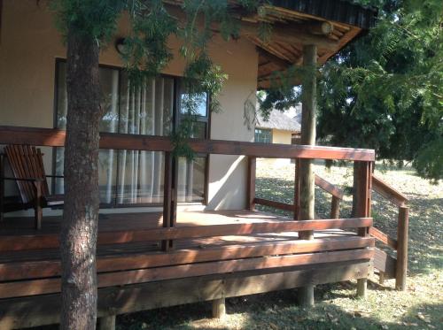 a porch of a house with a tree at Jock of the Bushveld in Barberton