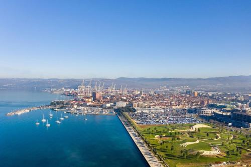 an aerial view of a harbor with boats in the water at Hisa dobrega pocutja in Kozina