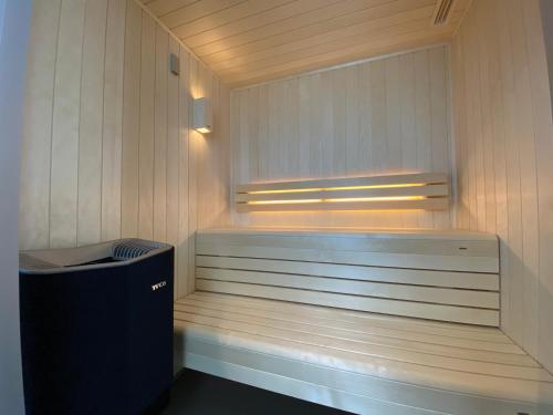 a bath room with a tub and a window at La Paix Hôtel Contemporain Brest centre ville in Brest