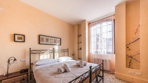 Postel nebo postele na pokoji v ubytování Residenza dell'Arte