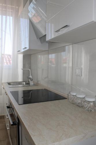 Kjøkken eller kjøkkenkrok på Jeta Studio & Rooms