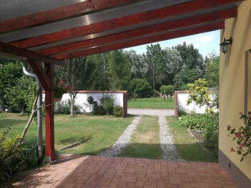 an entrance to a house with a brick walkway at Ubytování U Špačků Pálava in Novosedly