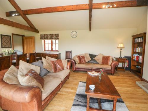 a living room with two couches and a table at Ellaberry in Darlington