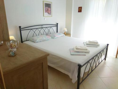 Postel nebo postele na pokoji v ubytování Emerald Apartment with Sea View