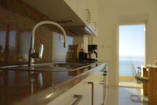 a kitchen with a sink and a counter top at Villa Annika in Lovran