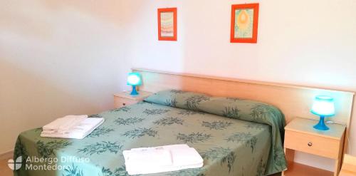 Postel nebo postele na pokoji v ubytování Hotel Diffuso Montedoro