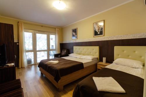 Posteľ alebo postele v izbe v ubytovaní Bella Villa
